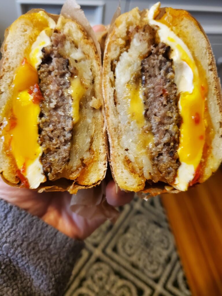 Made this breakfast on my lunch break. Egg sausage hashbrown patty with cheddar.