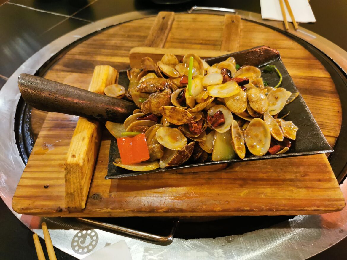 Stir fried clam cooked and served with a shovel, extra sandy please