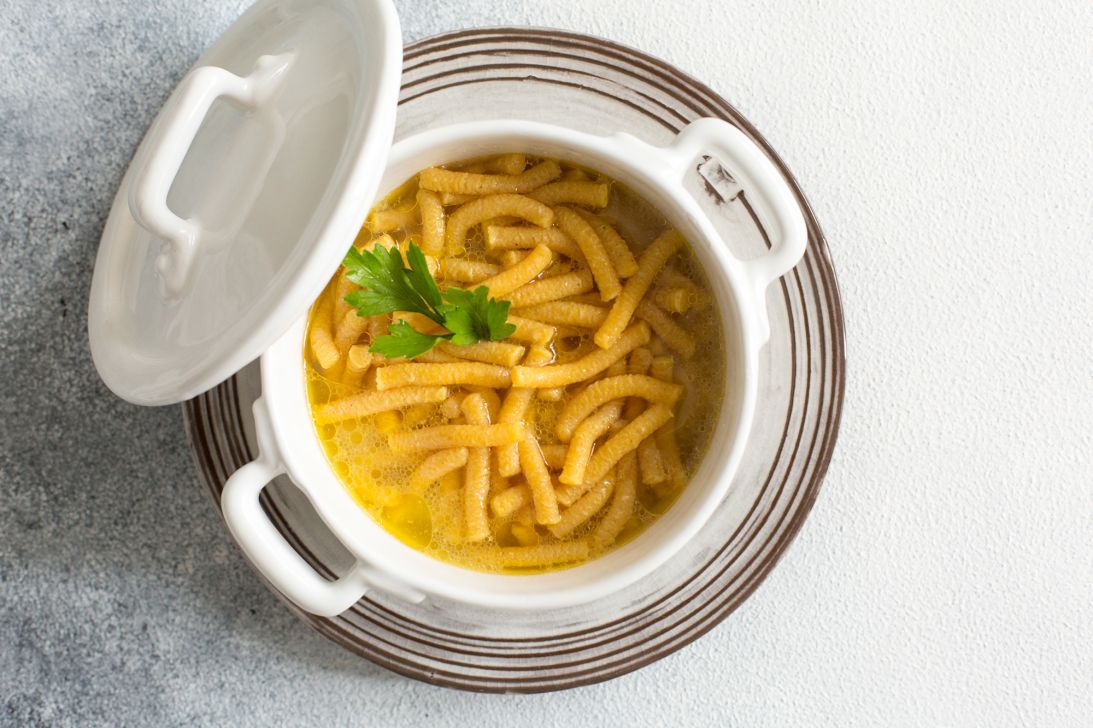 Chef Michele Casadei Massari describes passatelli as “breadcrumbs and Parmigiano Reggiano shaped into tender strands for broth.”