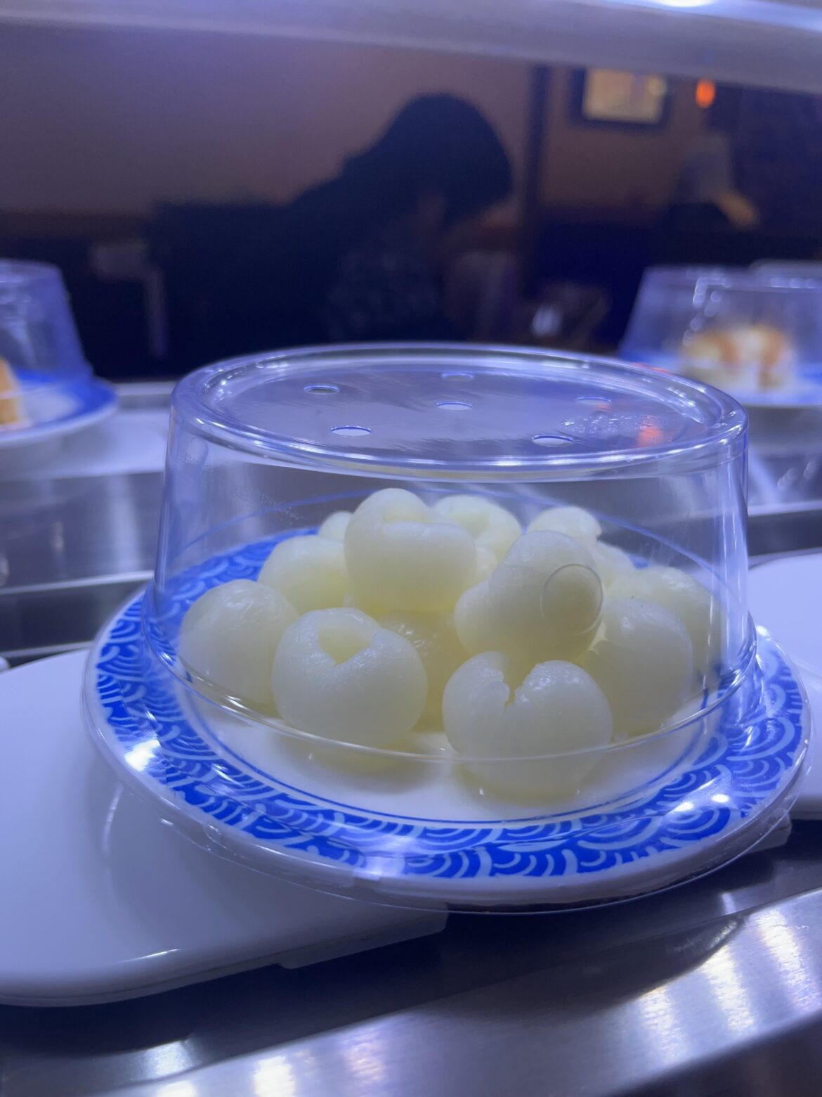 What is this fruit at the revolving sushi bar?