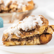 one slice of cinnamon roll pie on a white plate