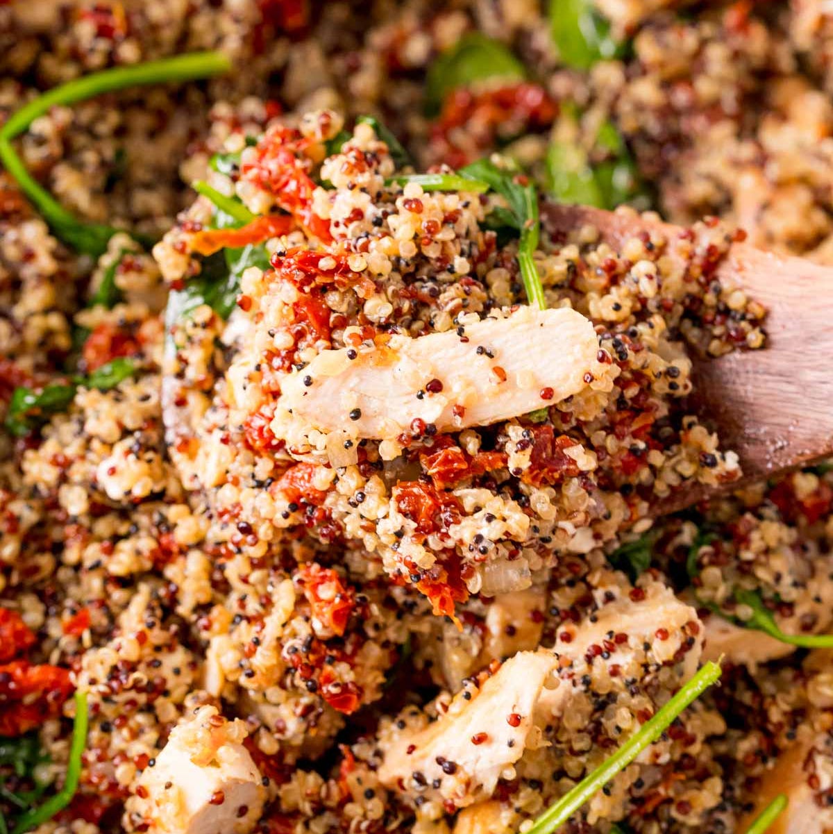 nutritious quinoa dish with vegetables and shredded chicken