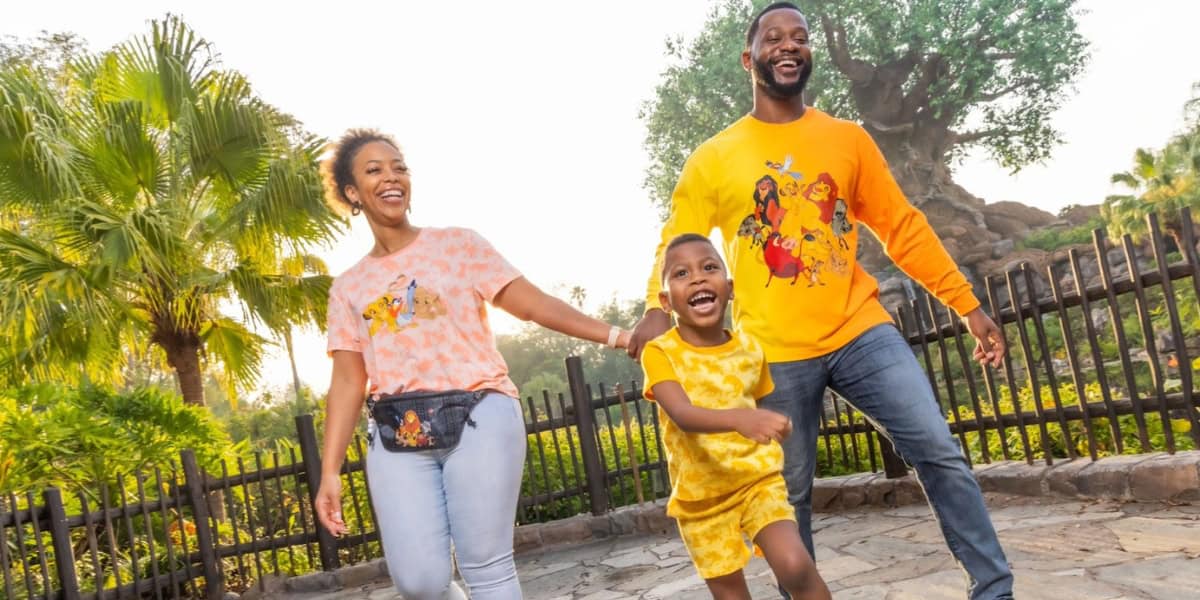A joyful family of three at Disney's Animal Kingdom