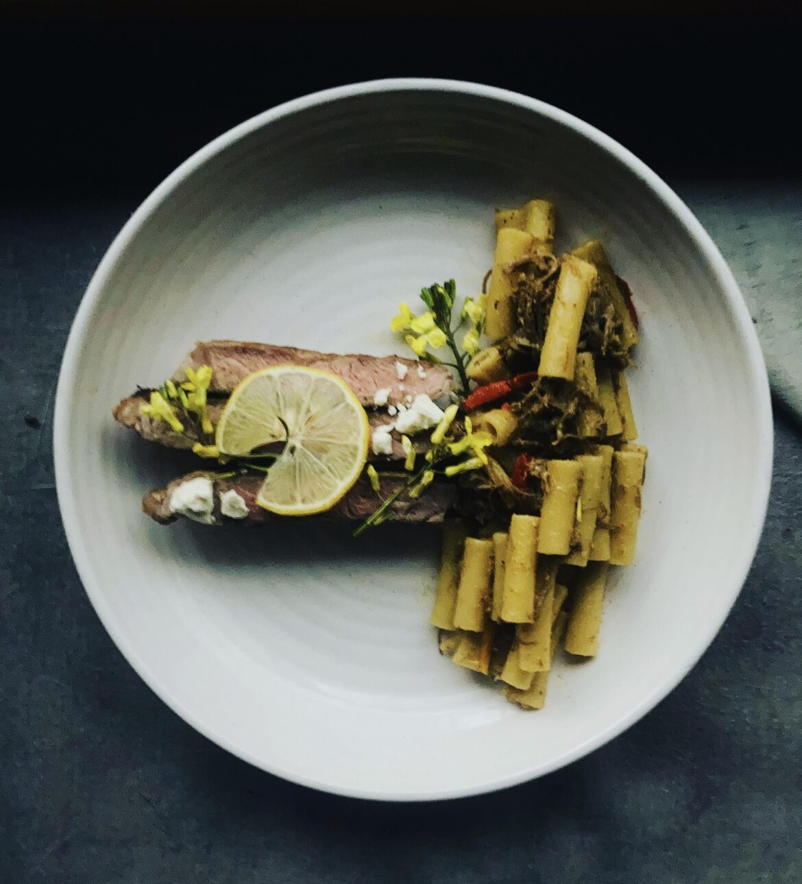 Slow roasted lamb pasta w lamb fat burr blanc paired w seared strip loin