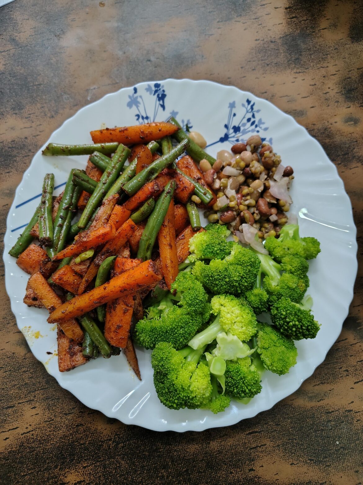 Sautaed veggies spiced with steamed broccoli and mixed beans