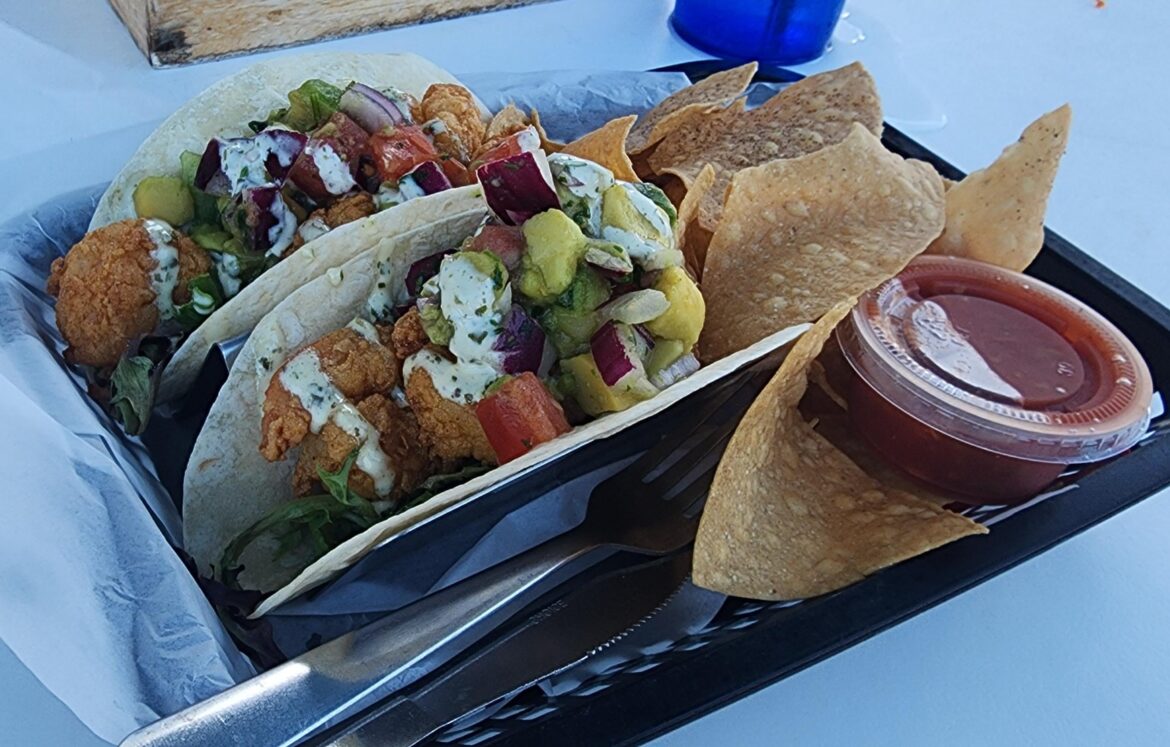 Some shrimp tacos and house made chips at the beach.