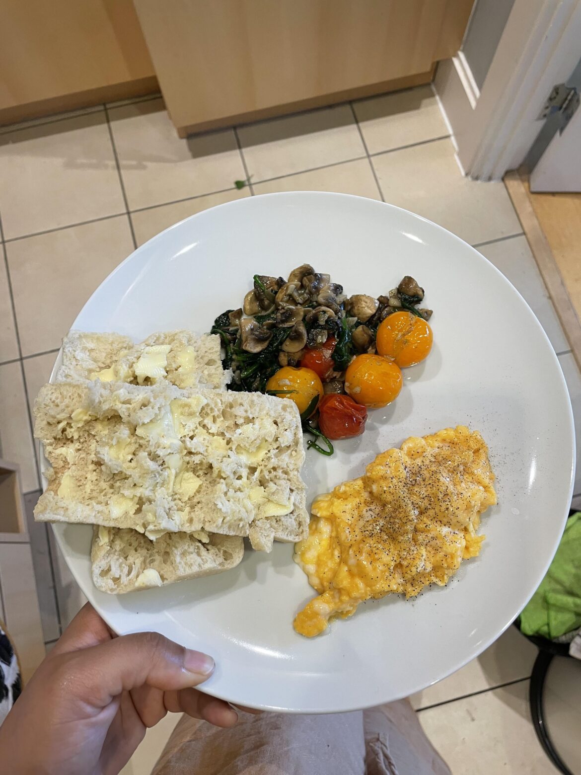 Garlic mushrooms, spinach and cherry tomatoes with fancy scrambled eggs and buttered fresh sourdough