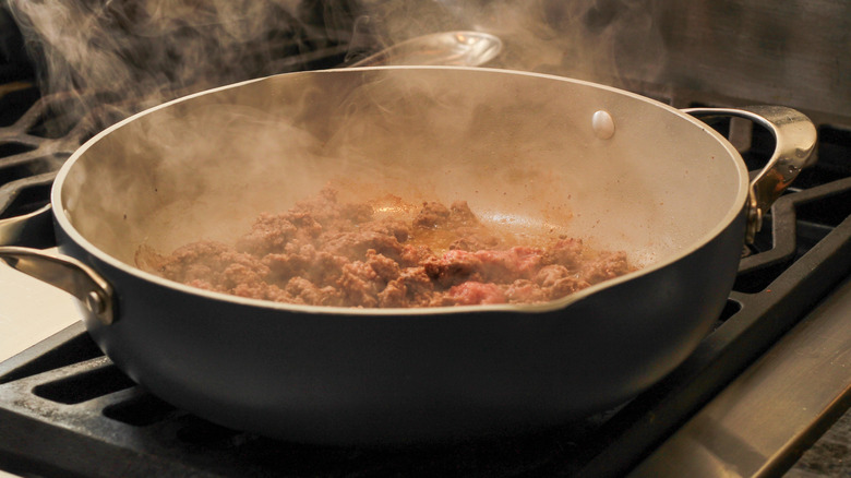 Browning ground beef in pan