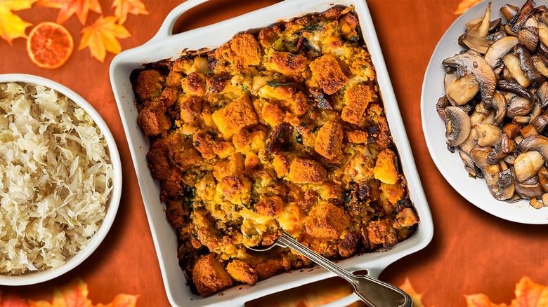Composite Thanksgiving dinner table with sauerkraut, sourdough stuffing, sauteed mushrooms