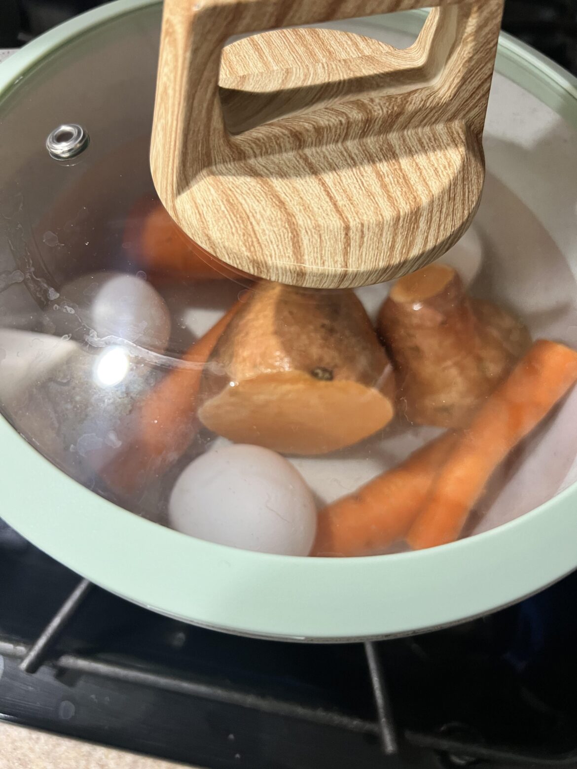 Boiling my eggs, carrots & sweet potato in the same pot