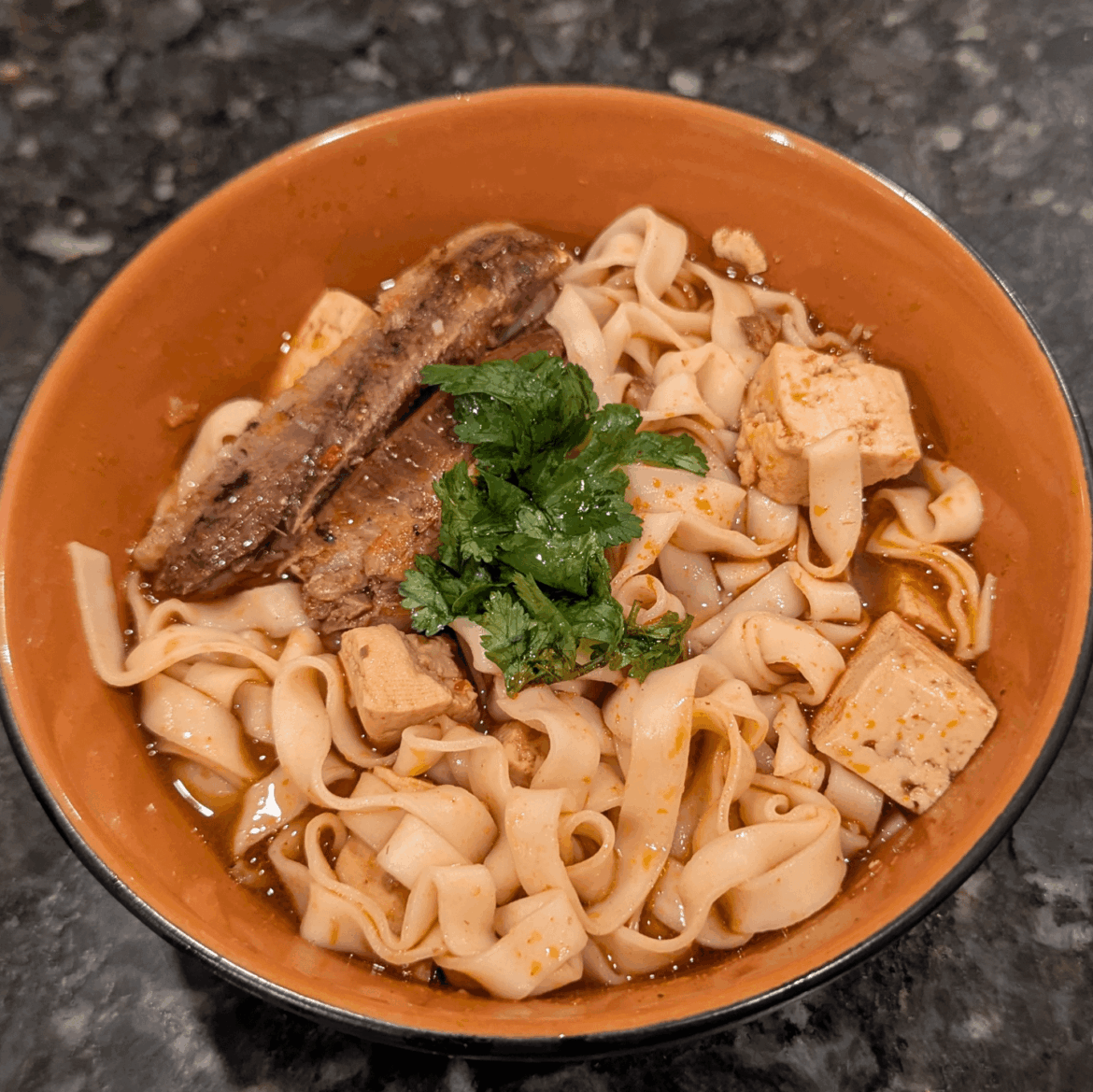 Ugly photo but I know you fiends won't mind: boneless skinless (365/Whole Foods) and tofu in Szechuan chili and lemongrass broth with noodles. Cilantro.
