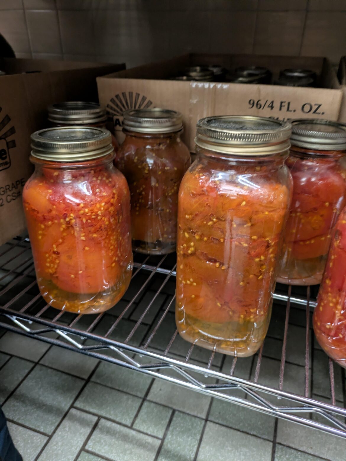 Just started volunteering at a church food pantry. Could this indicate spoilage? Or is it normal for canned tomatoes to separate like this?