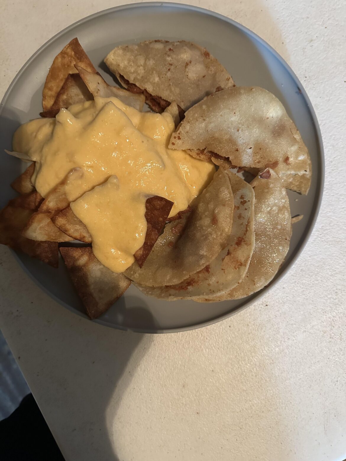 Crispy refried bean tacos and homemade corn tortillas chips. Nearly everything is used from Dollar Tree.