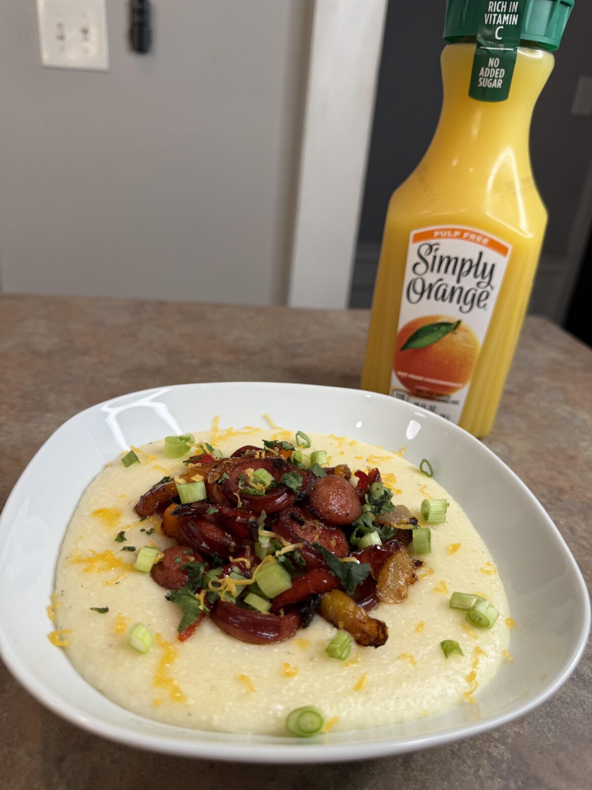 Made cheesy grits with sausage and peppers this morning. Would you eat this for breakfast?