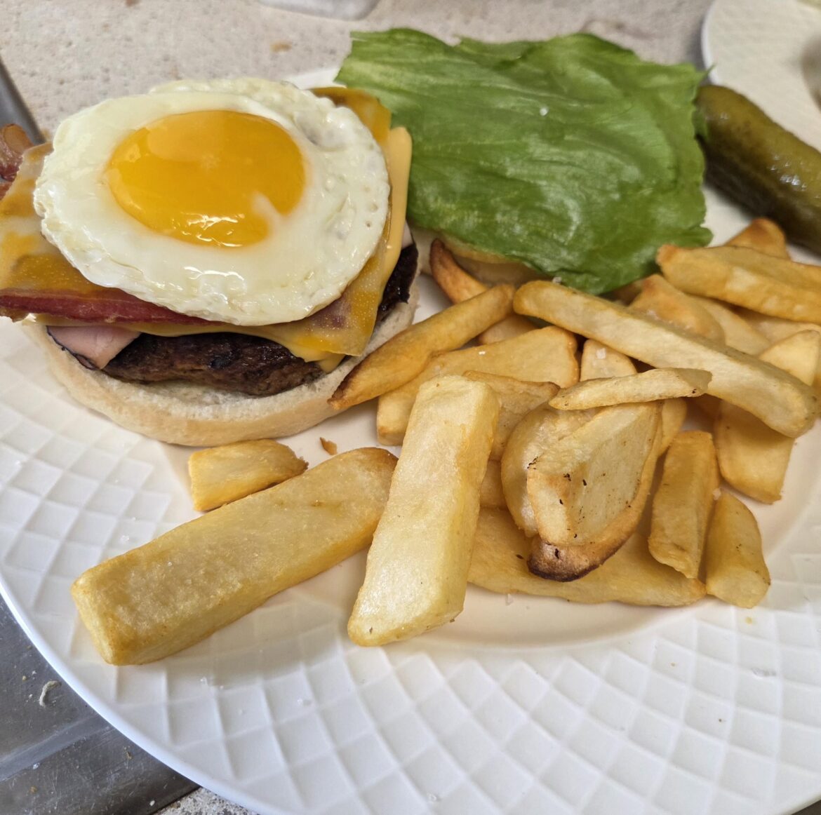 Asked the boy what he wanted on his burger...