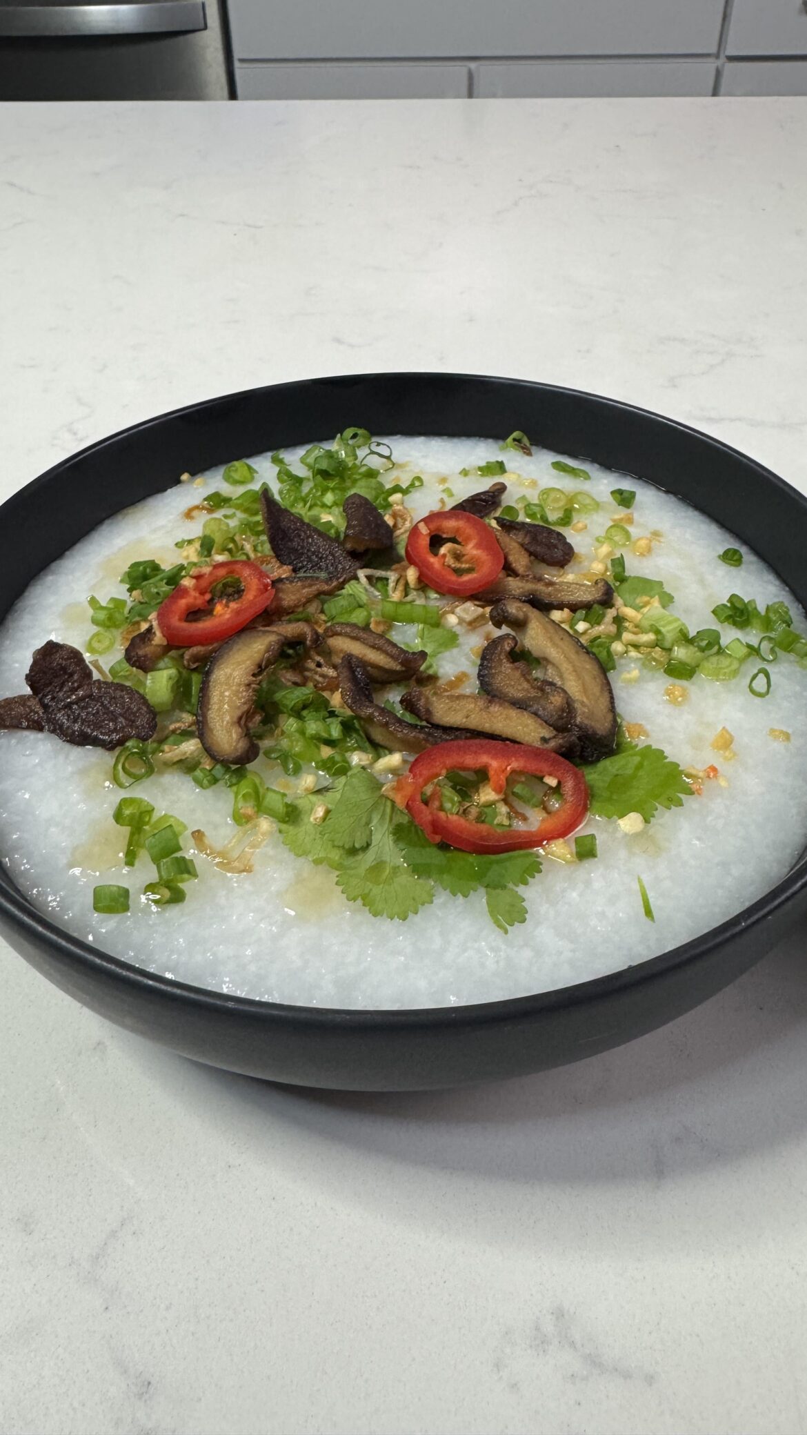 Congee, Garlic, Shallots, Shiitake, Fresno Peppers, Cilantro, Scallions, Chili Oil