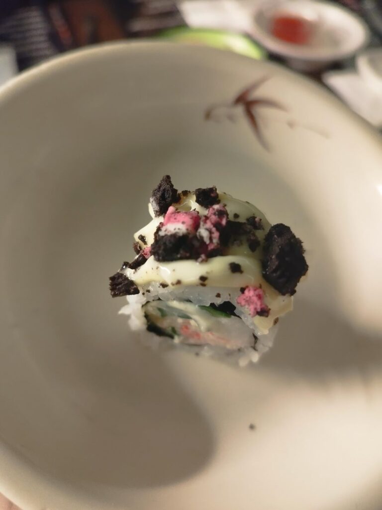 Sushi with crushed oreo and freeze dried raspberry on top