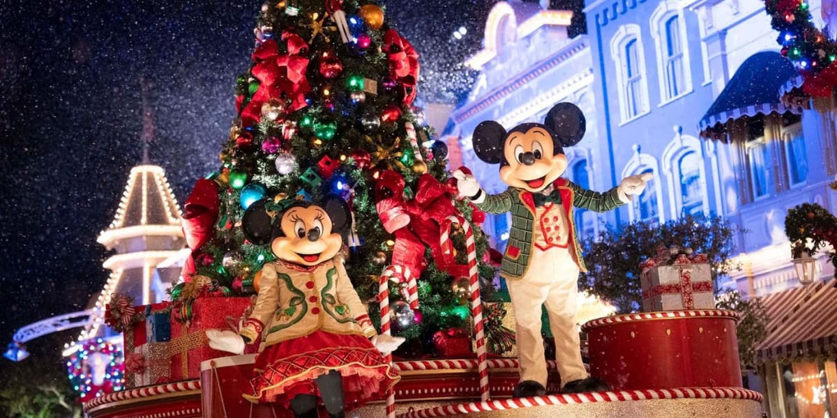 Mickey and Minnie Mouse, dressed in festive holiday outfits at Disney World.