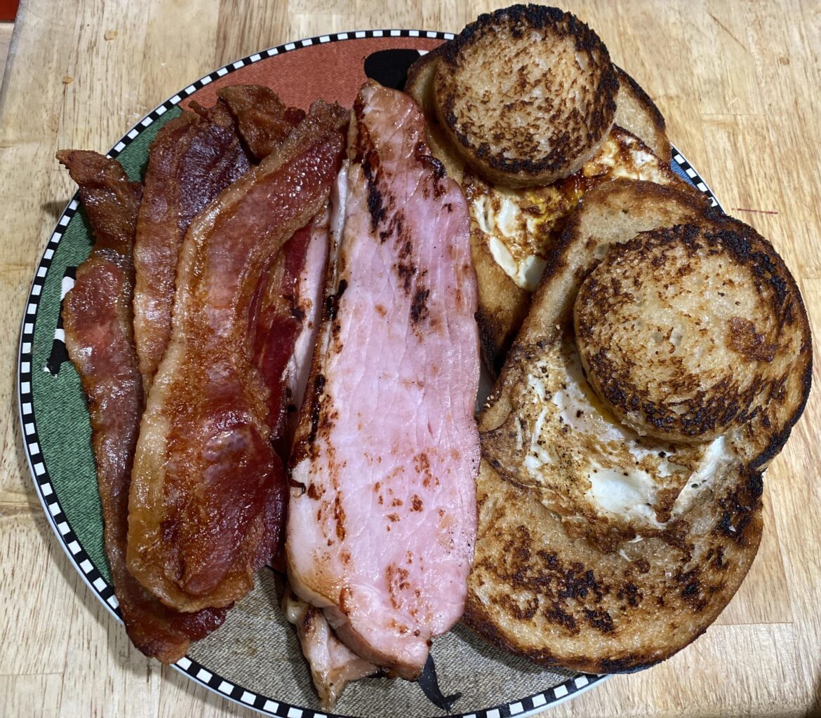 Bacon, ham steak, and egg-in-a-nest