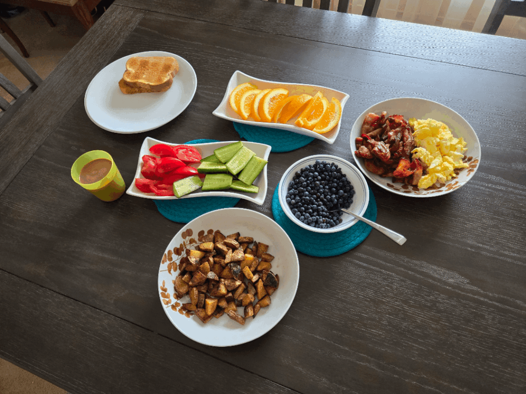 Bacon, Eggs, Homefries Fruits and Toast