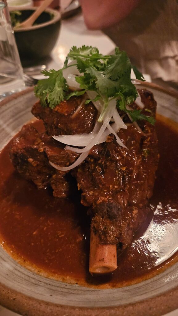 Lamb shank, mole and lengua tacos from Casa Enrique in Long Island City