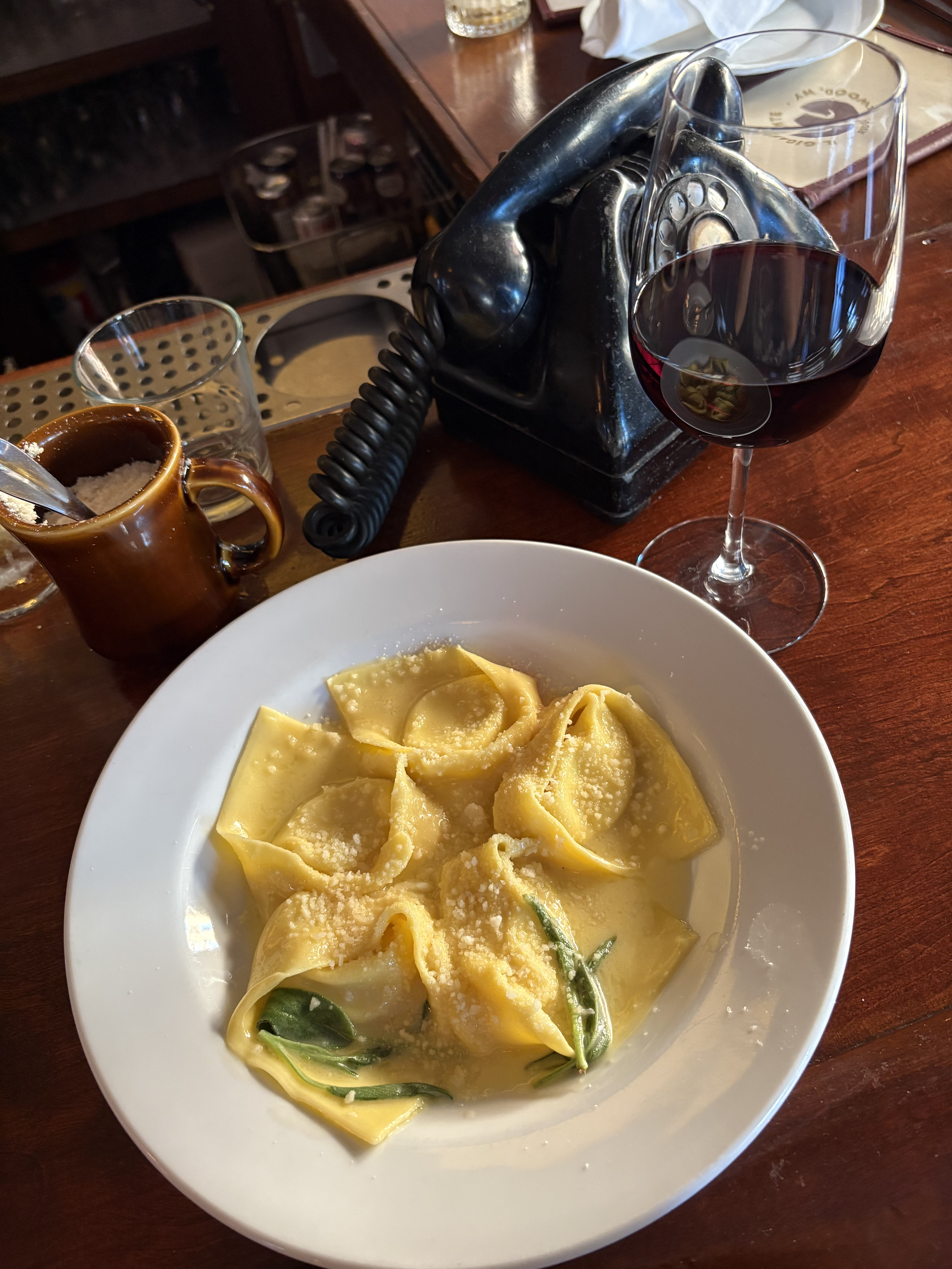 A plate of Tortelloni Burro e Salvia and a glass of Supertuscan at Il Gigante in Ridgewood. 