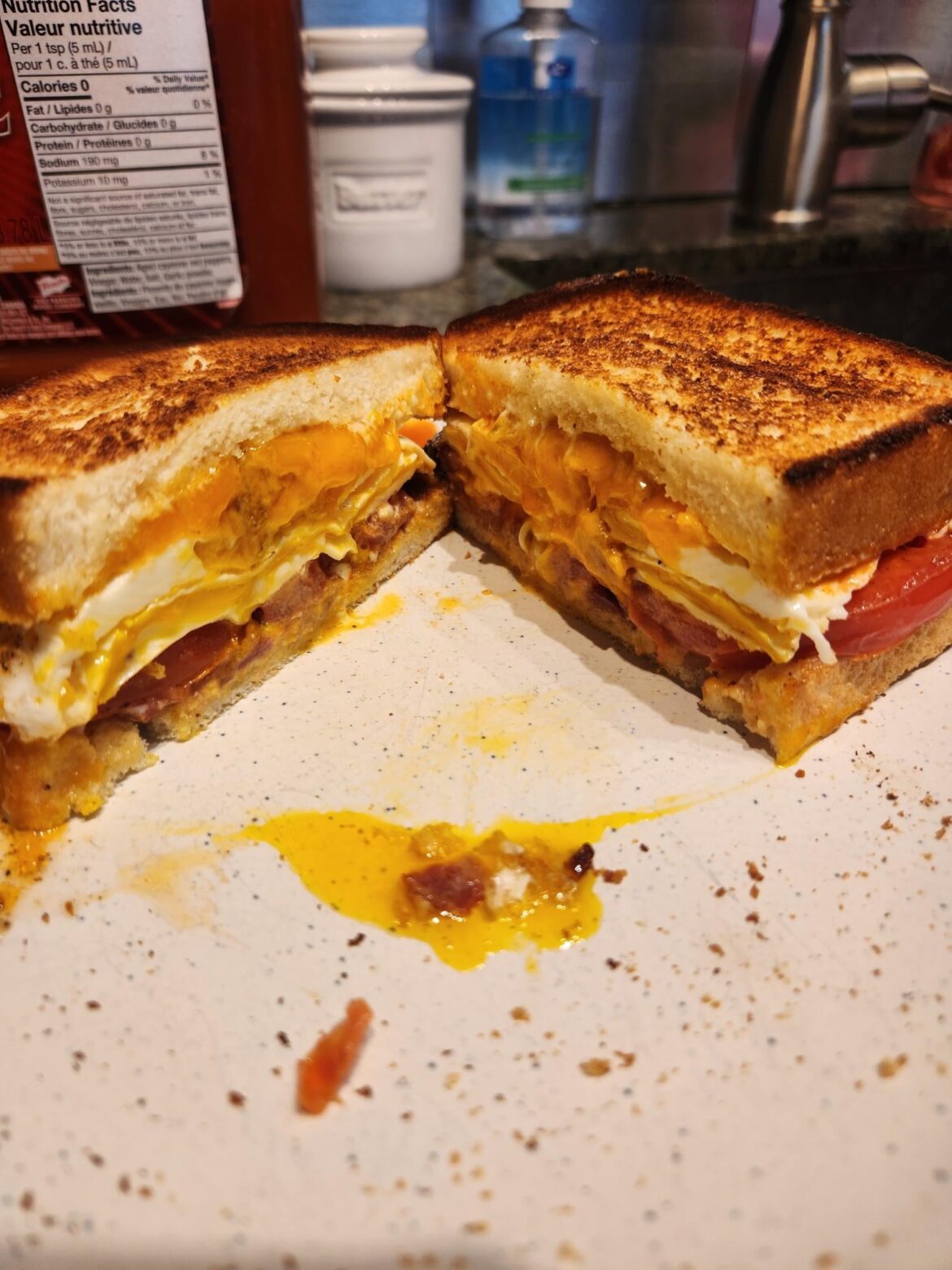 Grease level 100. Fried bacon, fried egg, fried tomato, and fried cheese on toast.