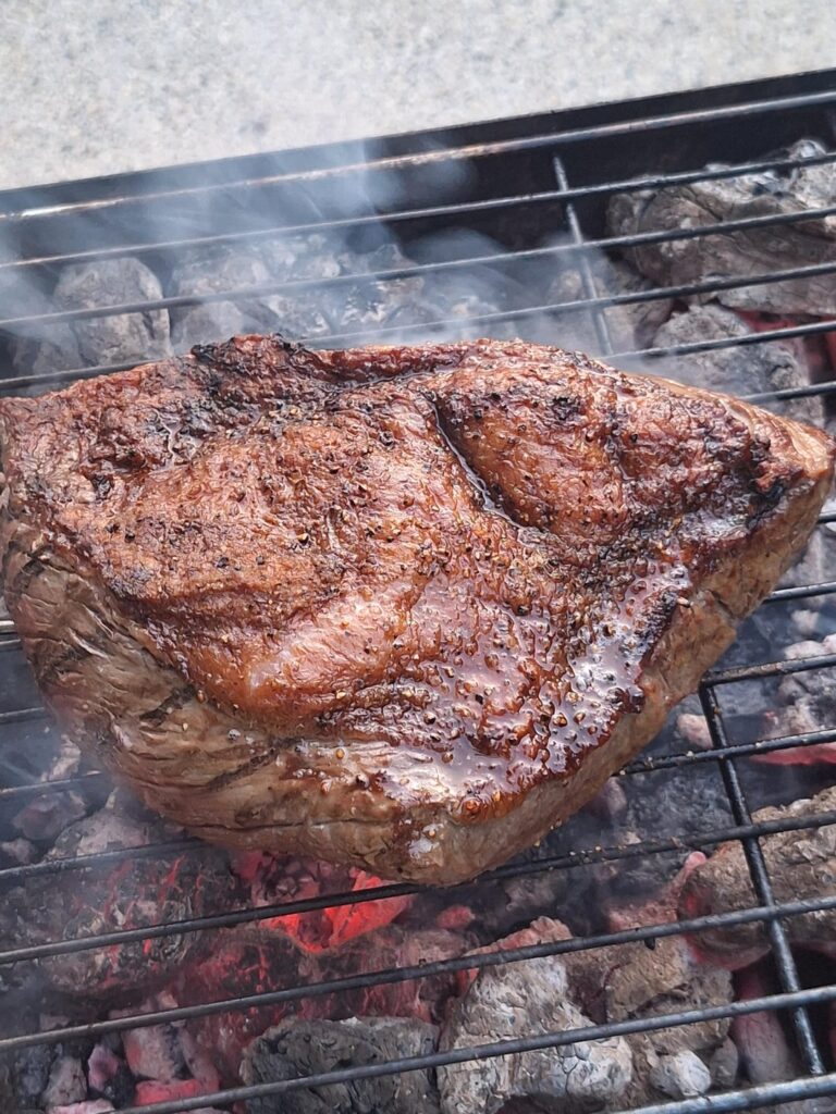 Whole rump-cap cooked on coals