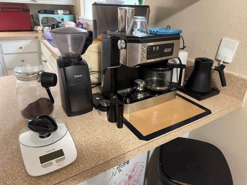 My thrift store coffee station. Delonghi 530m with steam wand replacement and Baratza Encore.