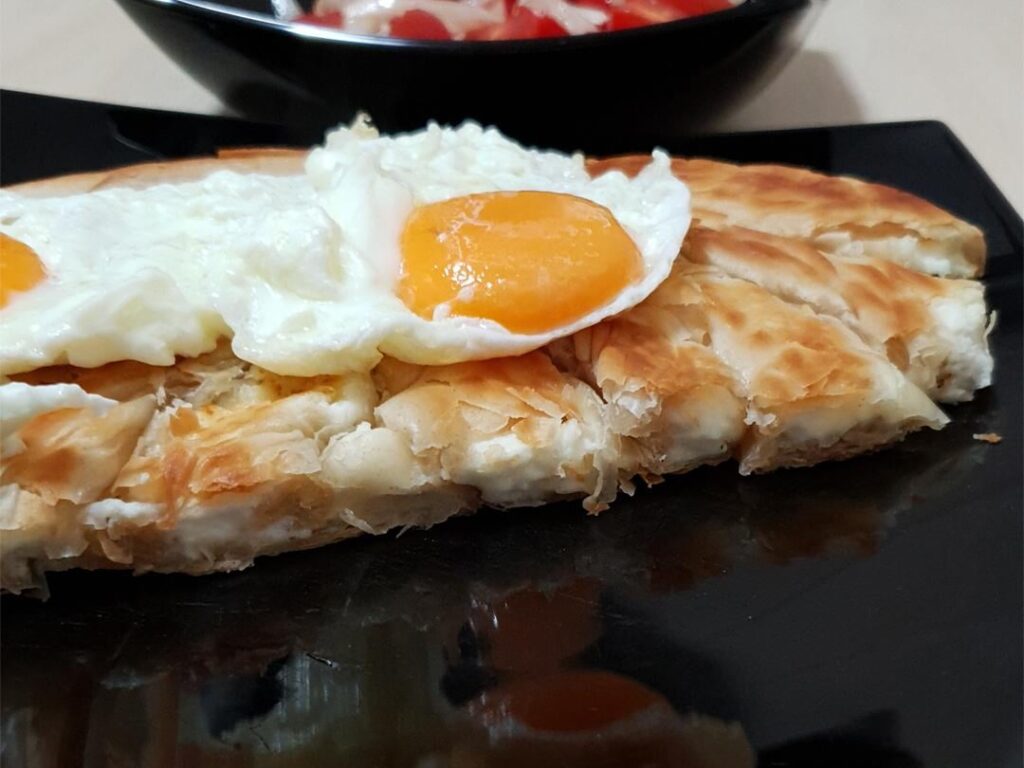 Filo cheese pie, eggs and salad