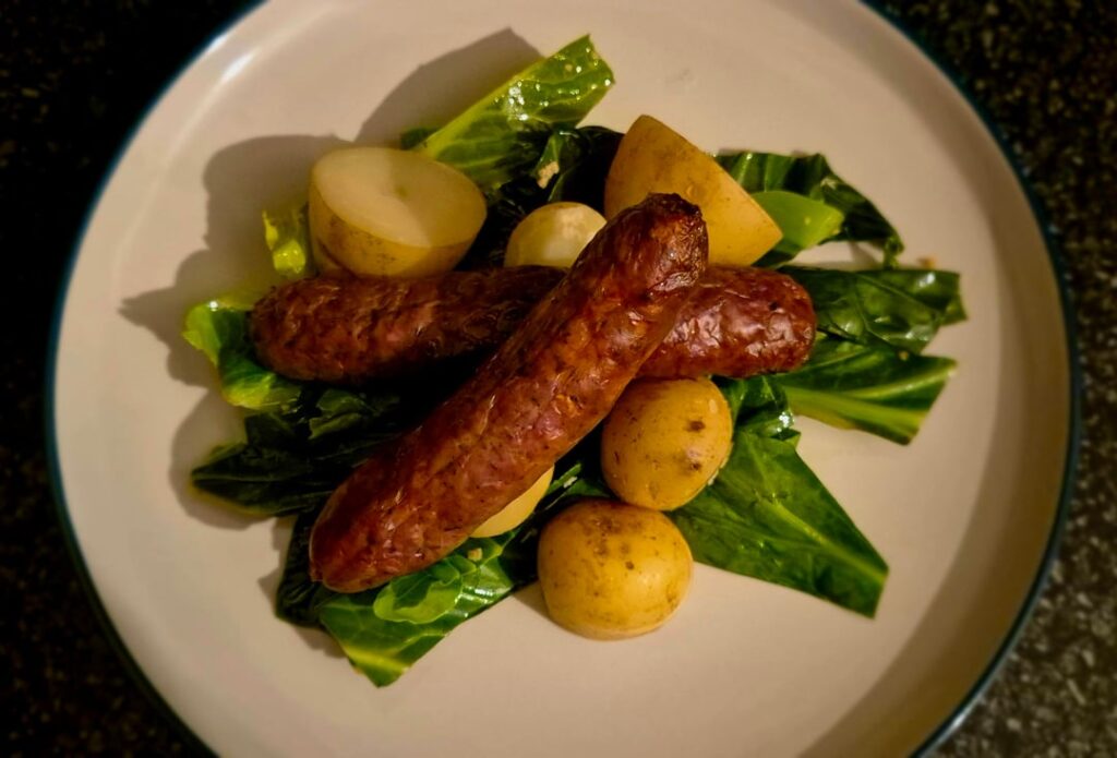 Venison sausages, garlic butter sautéed "greens" and new potatoes. Swipe for gravy pics.
