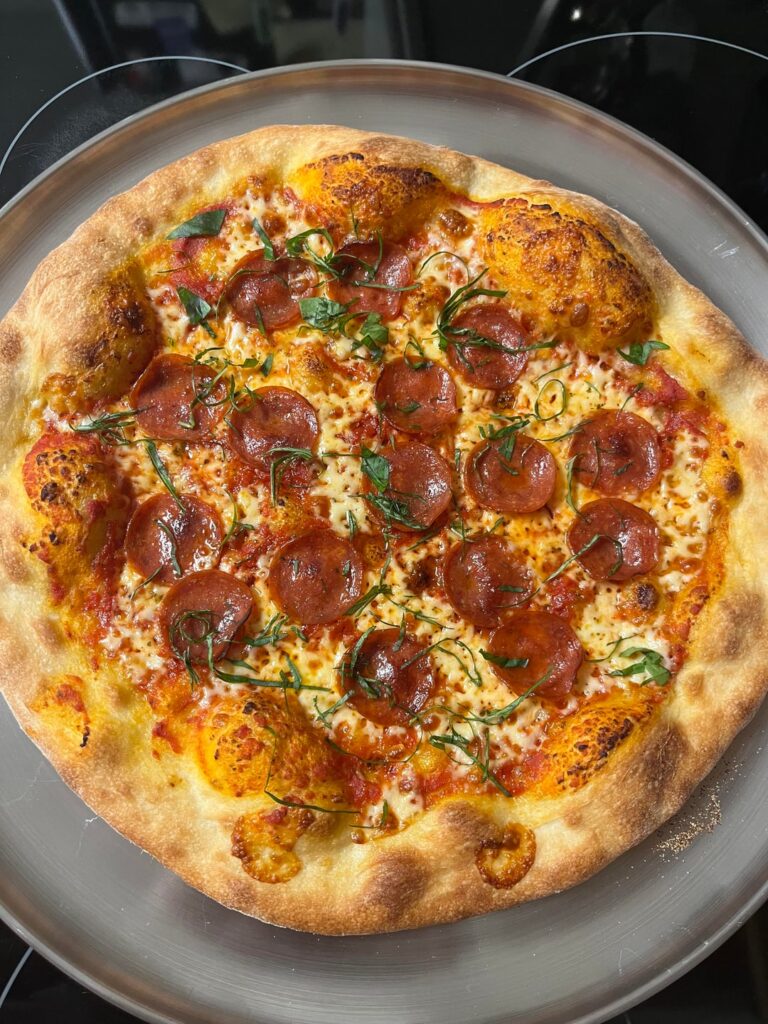 NYish style pizza I made on cast iron steel at 550f