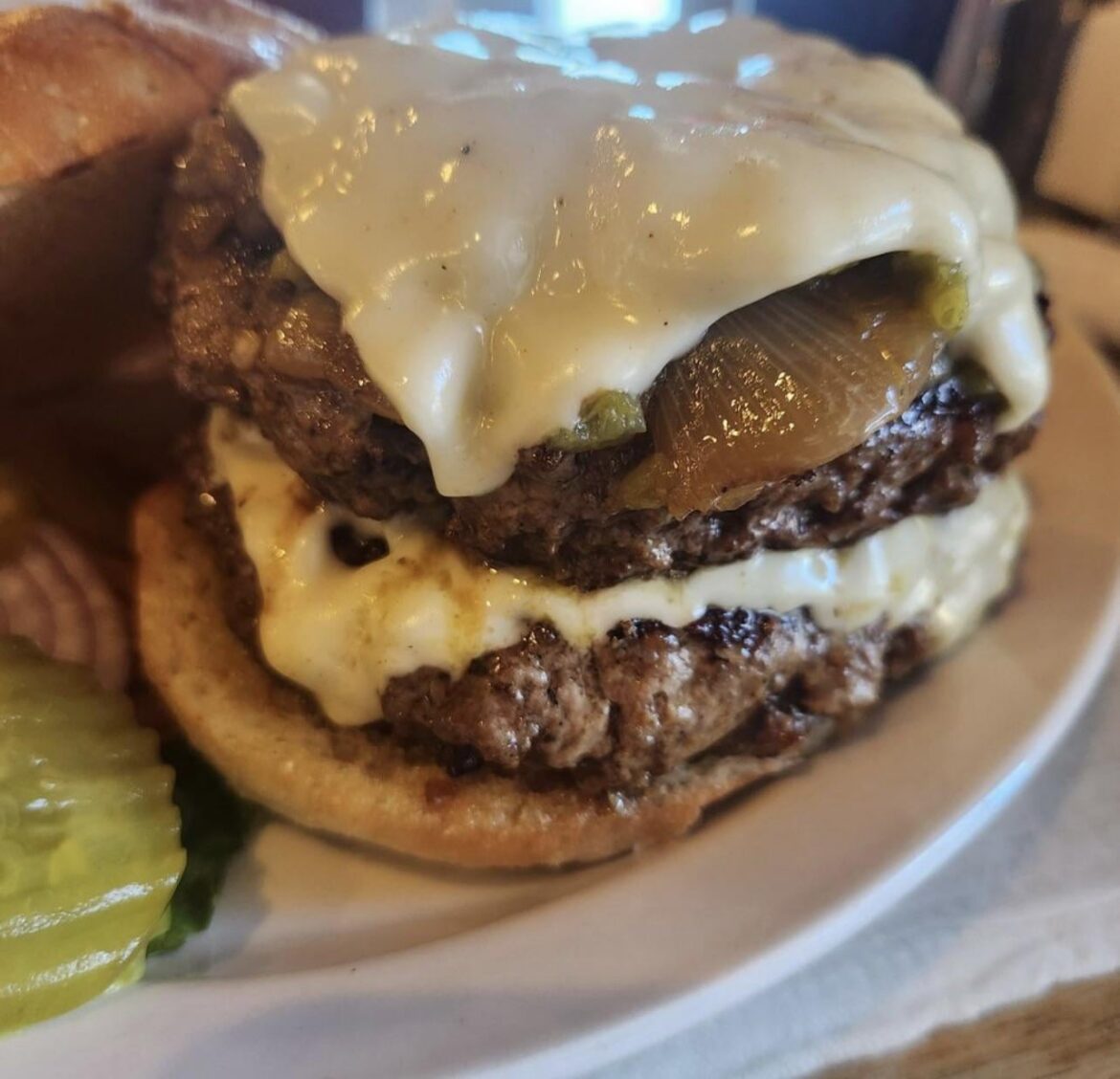 Double green chile cheese burger with grilled onions