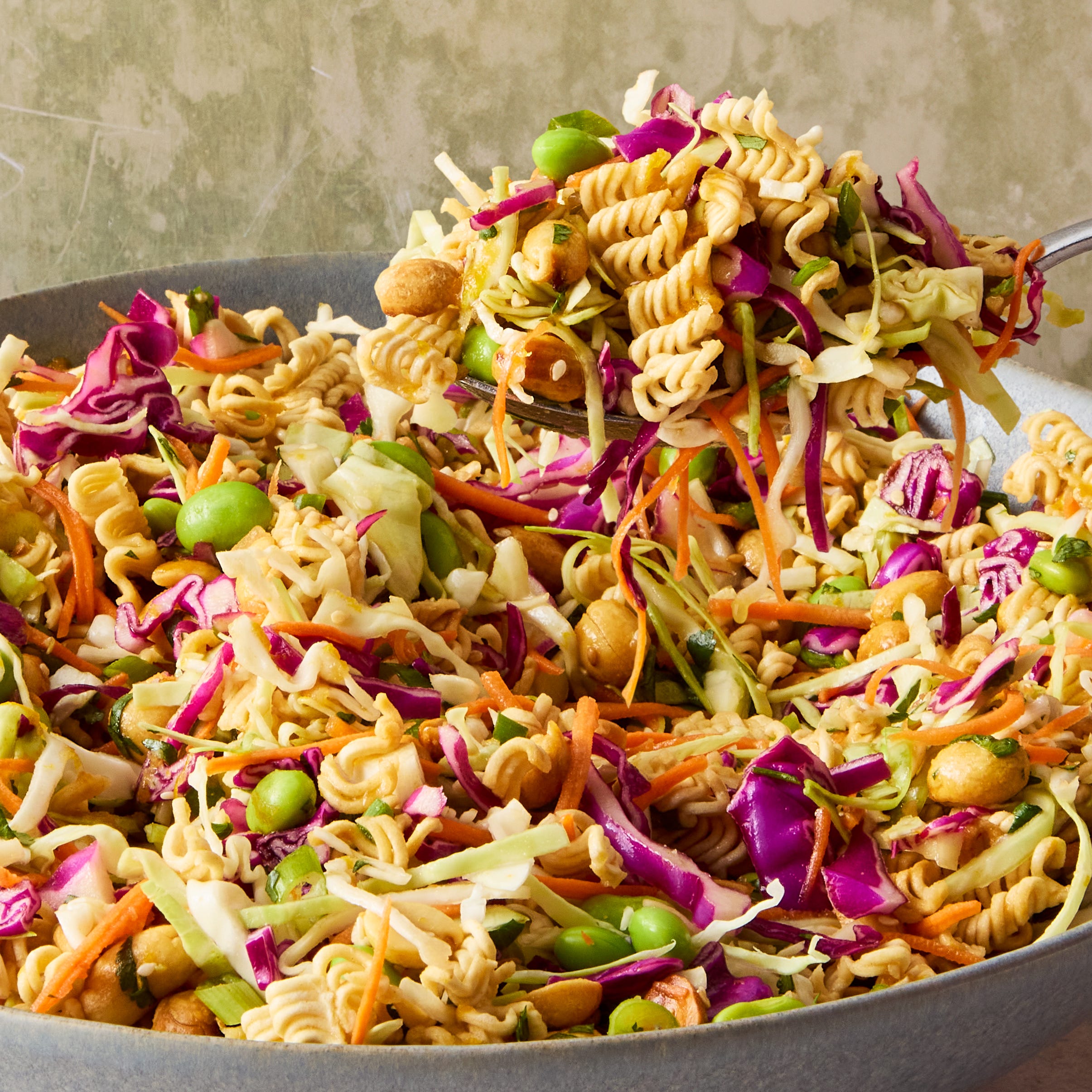 ramen noodle salad with edamame, purple cabbage, and peanuts