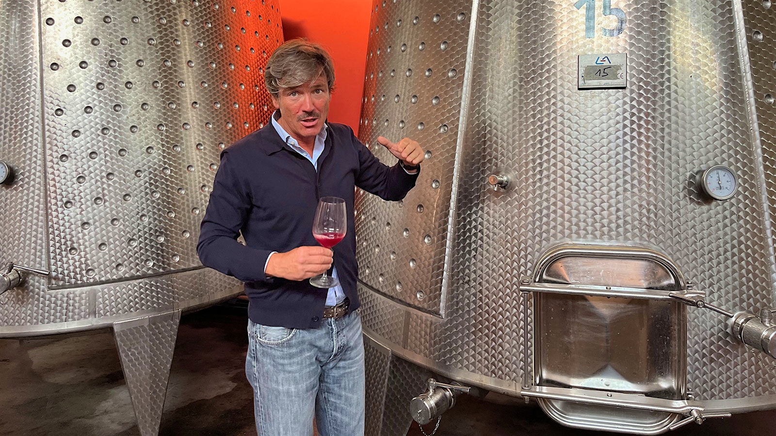  Villa Della Torre CEO Andrea Lonardi tasting wine inf front of stainless steel tanks