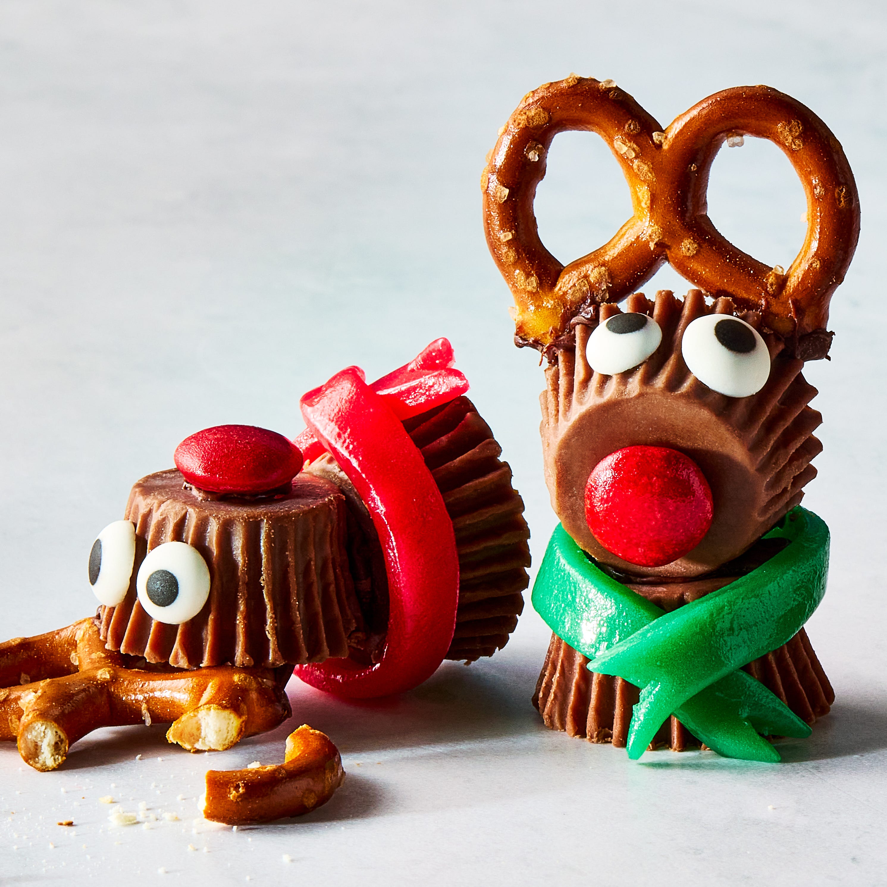 reeses candy stuck together with pretzels to make mini reindeers