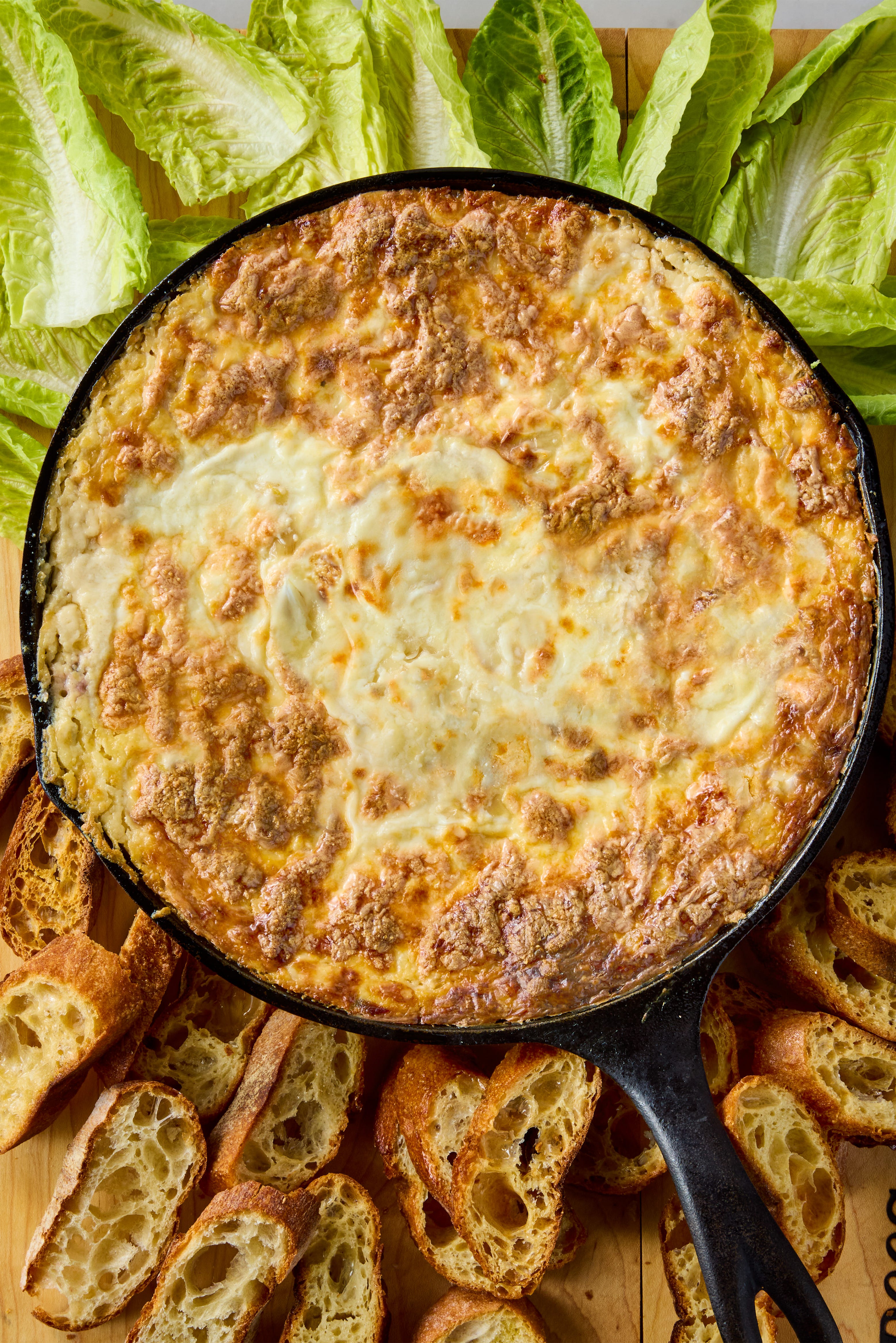 creamy baked dip with veggies and bread