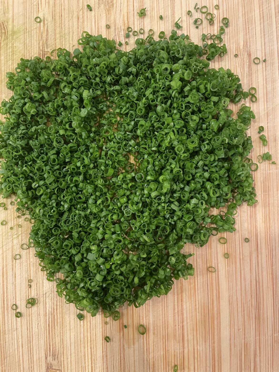 Cutting a couple of chives almost every day until this reddit says they're perfect. Day 45