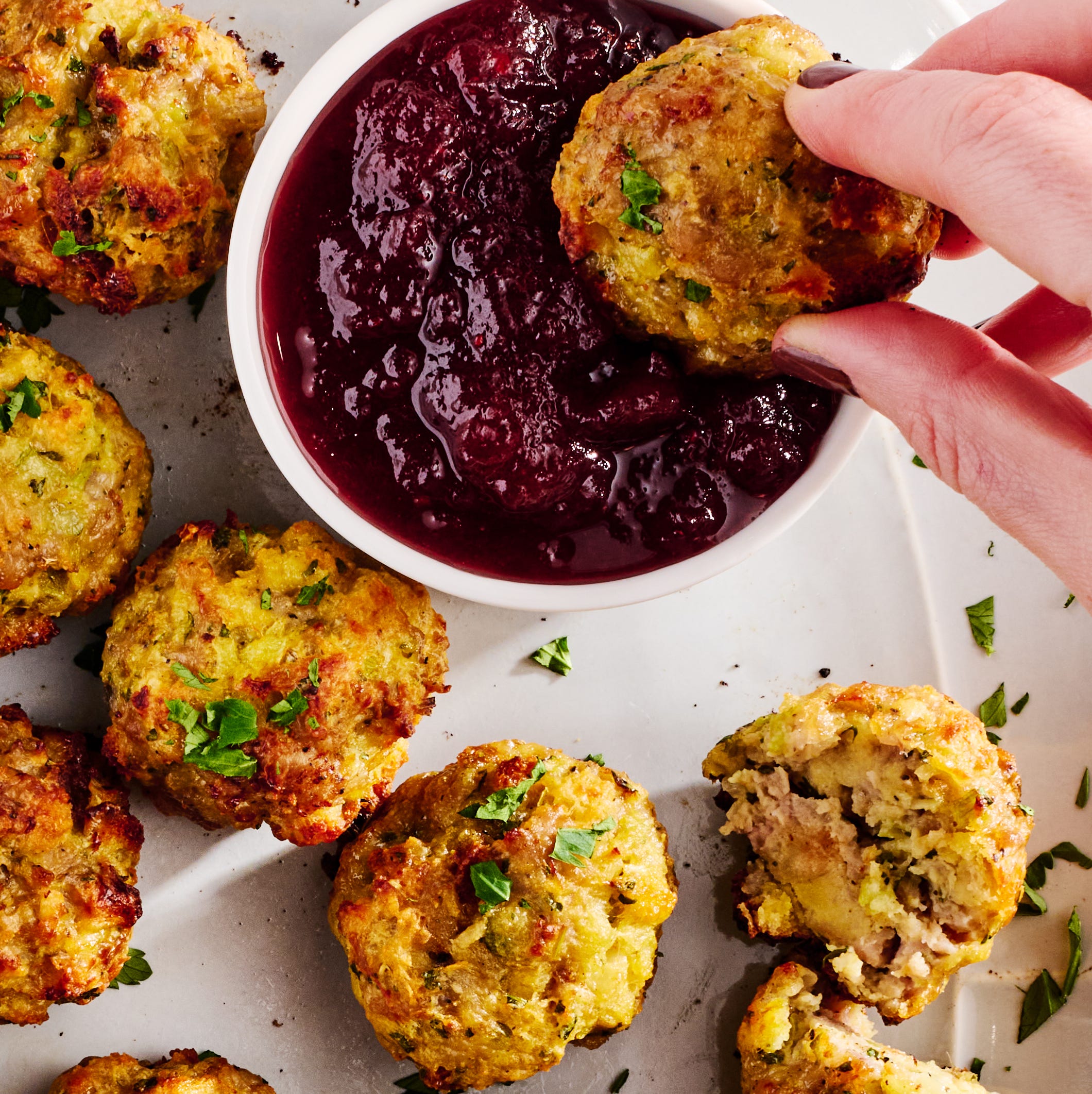 sausage stuffing bites with cranberry sauce