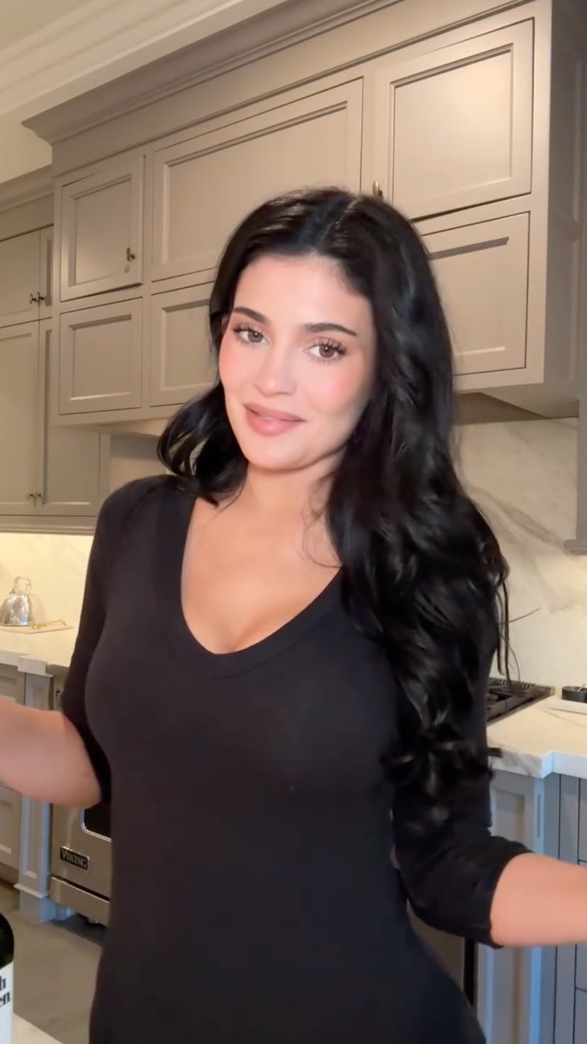 Kylie Jenner looked chic in a plunging black top.