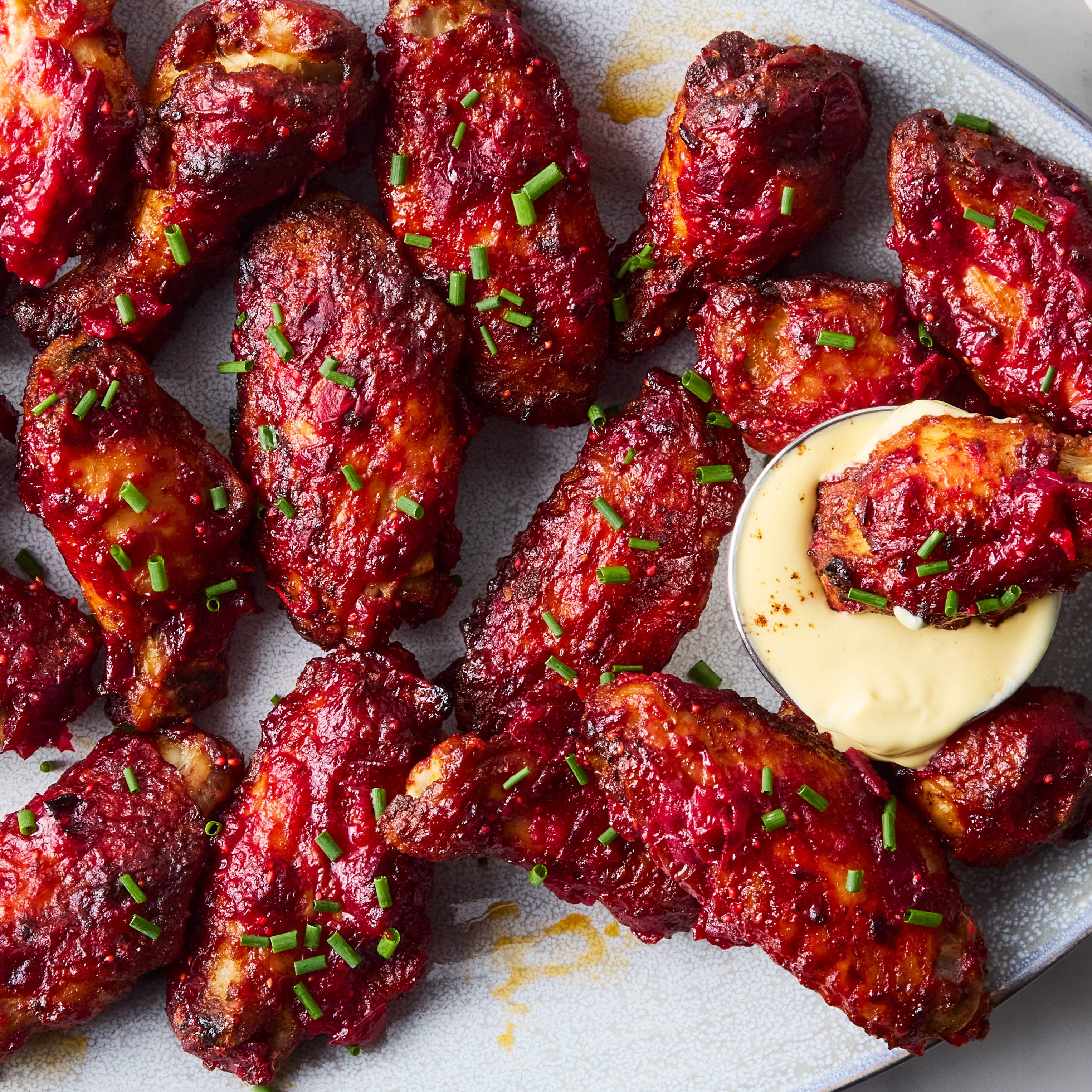 spicy, sticky cranberry wings with mustard dipping sauce