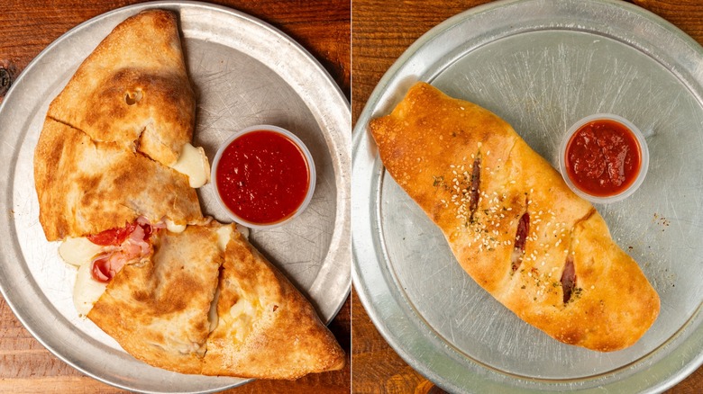 A split image of a calzone and a stromboli on metal trays next to a cup of red sauce