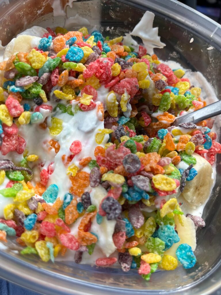 Fruity pebbles w/ banana and birthday cake and vanilla Greek yogurt :-) 337 calories 25g protein