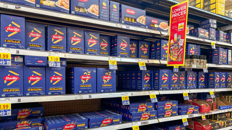 Blue boxes of various Barilla pasta in a store