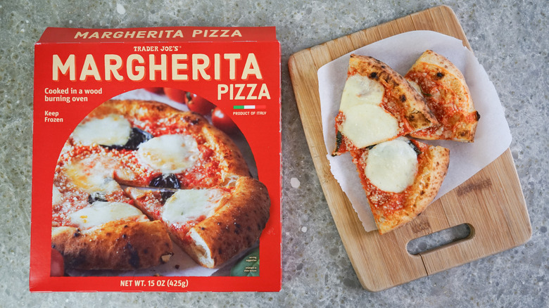 Trader Joe's Margherita Pizza next to slices on cutting board