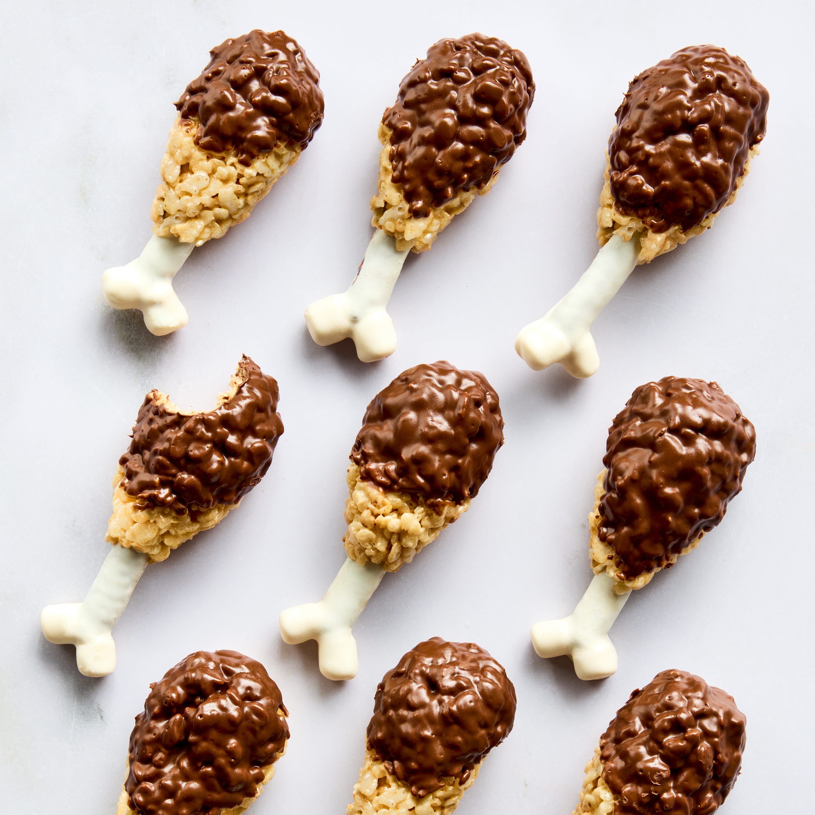 rise krispies shaped like turkey legs covered in chocolate with a white chocolate bone