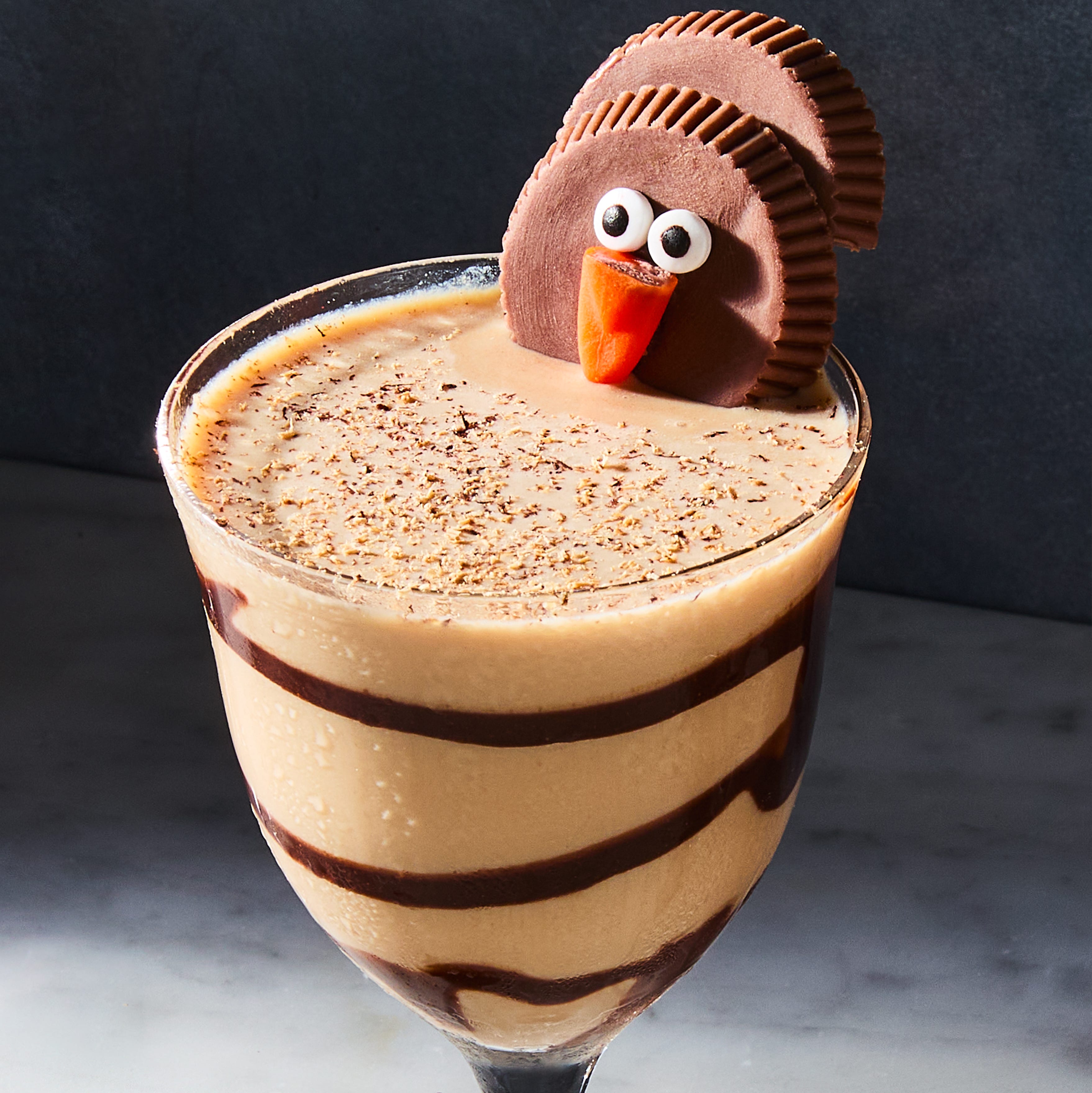 creamy cocktail topped with a turkey shaped like a reese's cup