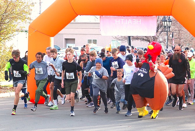 Turkey Trotters take off from the starting line at Minden Park for the ninth annual Carson Valley Community Food Closet fundraiser on Thanksgiving morning.