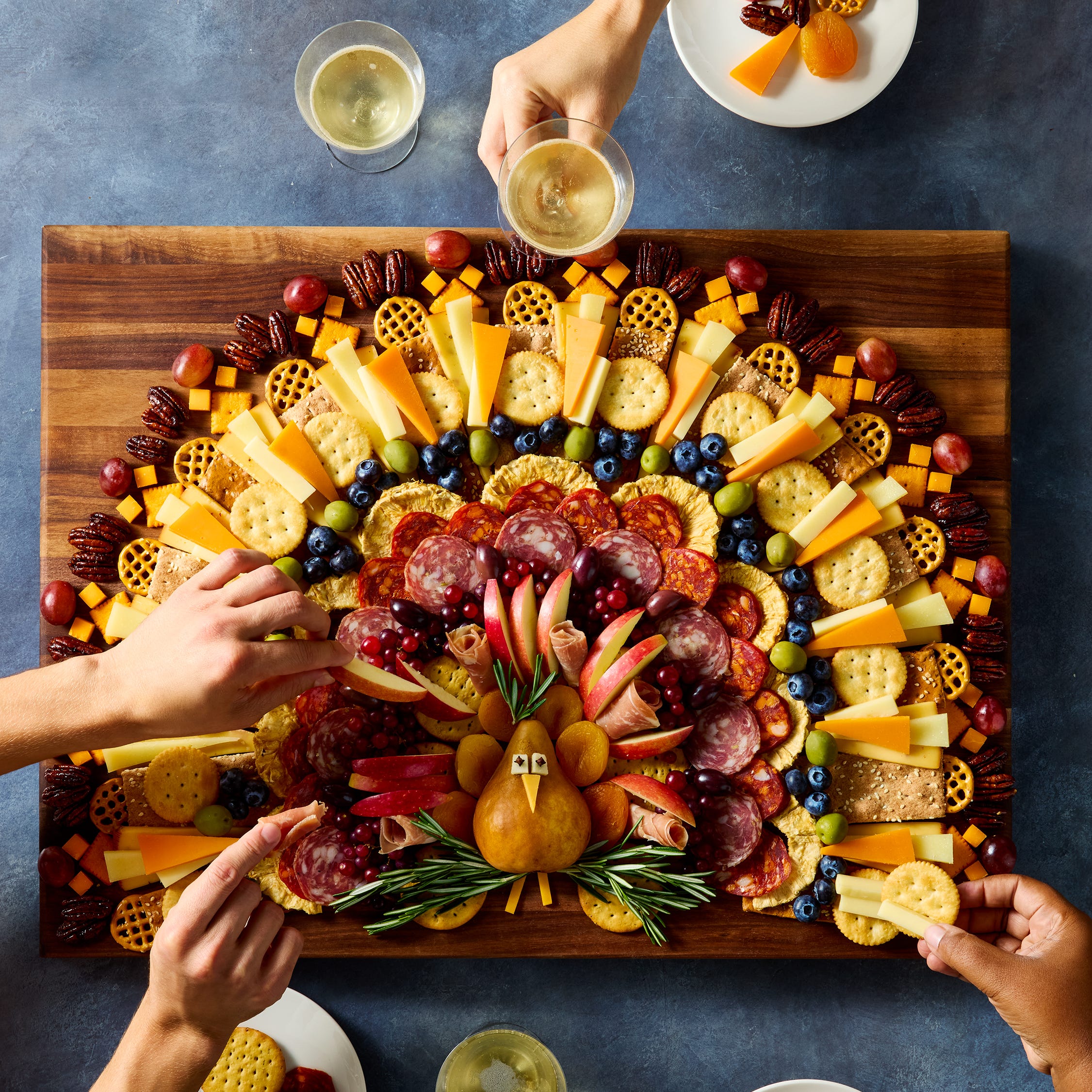 charcuterie board shaped like a turkey
