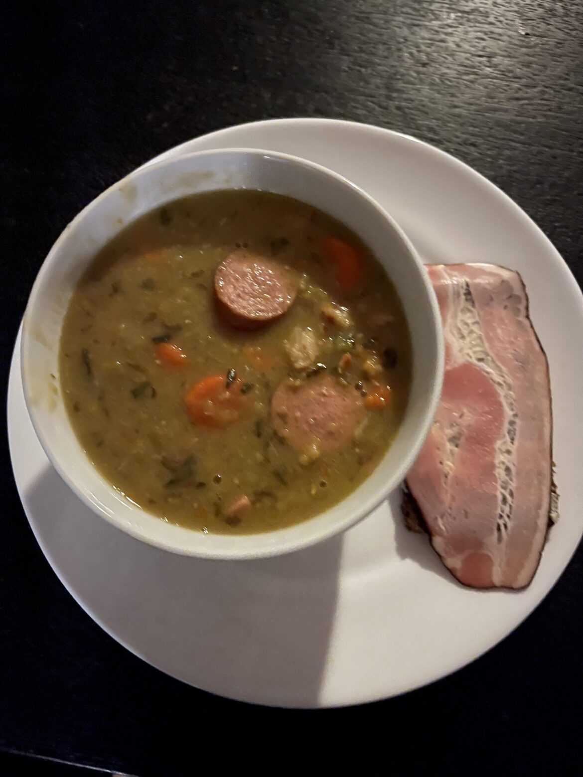 Snert (Dutch pea soup) with pumpernickel and bacon